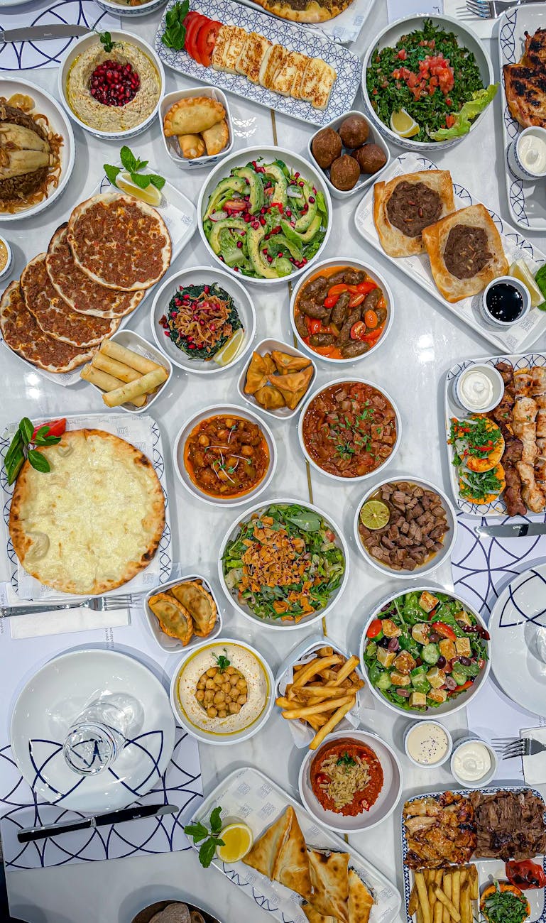 Experience an array of authentic Middle Eastern dishes beautifully arranged on a table, perfect for culinary exploration.